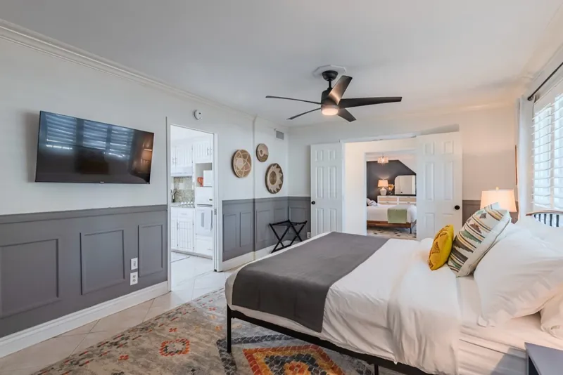 Wainscot room after: gray wainscot, a Southwest rug and woven wall baskets