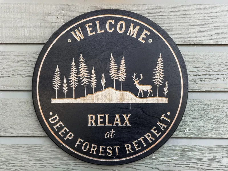 Round Relax at Deep Forest Retreat welcome sign