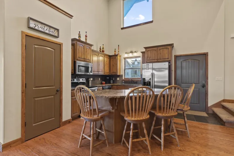 Kitchen before: an oak table and chairs crowding the island