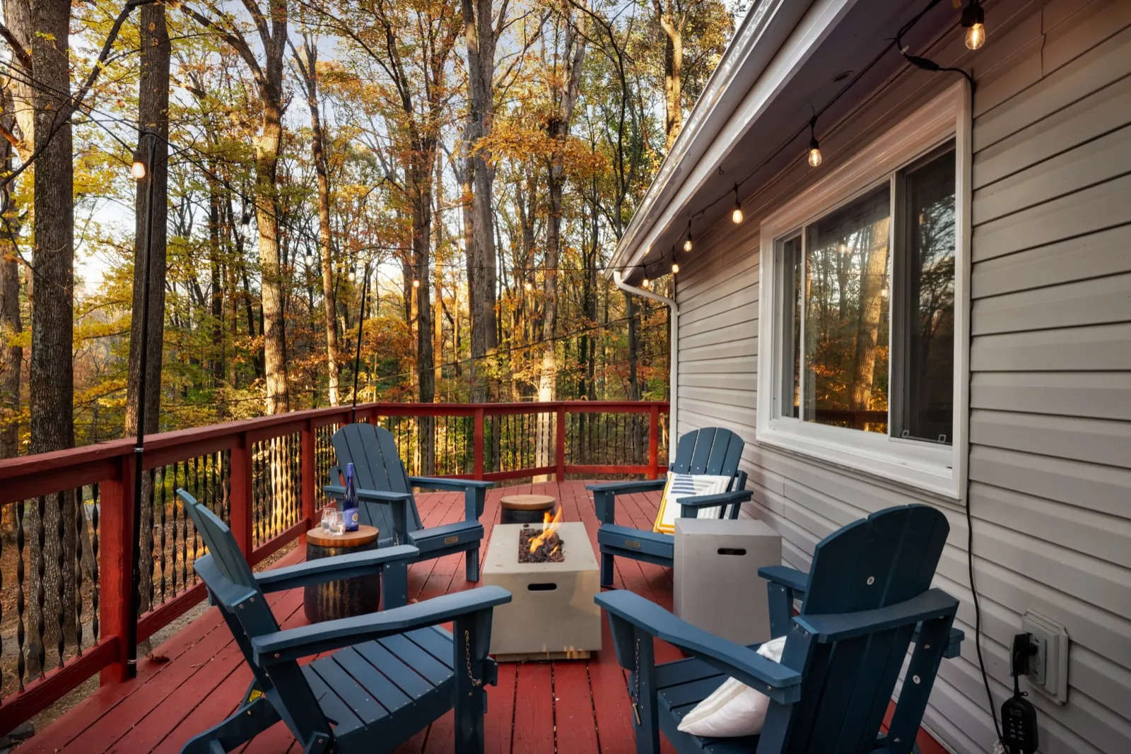 Deck lounge after: Adirondacks pulled in around the fire