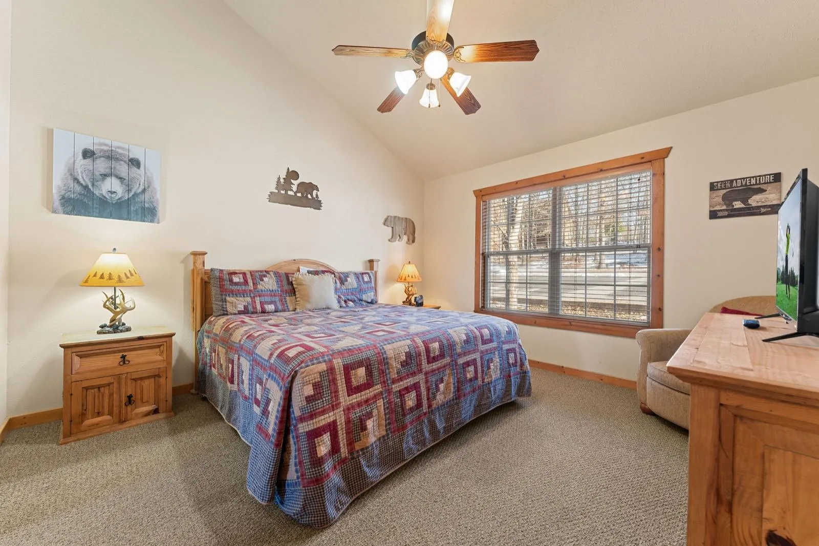 Bear room before: patchwork quilt and scattered bear art