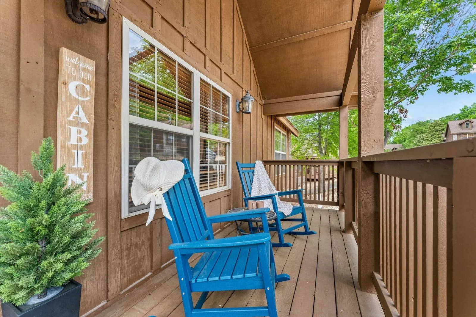 Looking down the front porch past the blue rockers