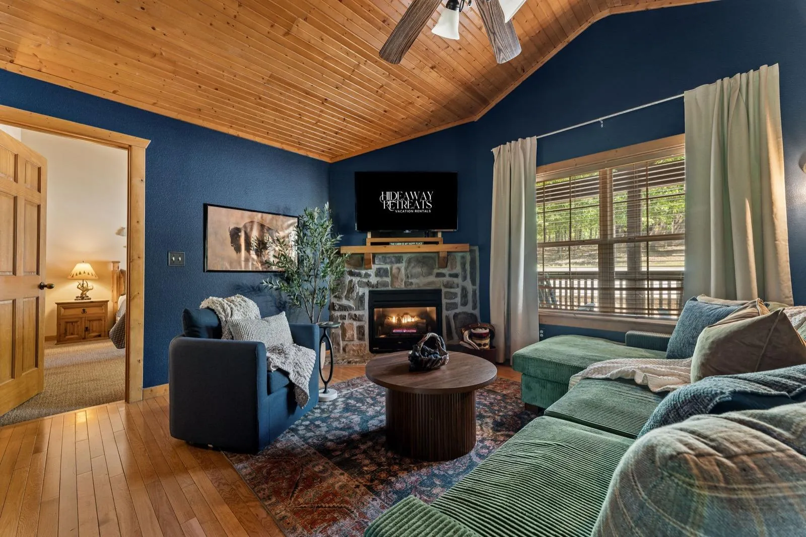 Living room after: swivel chair, fluted round table and a vintage-style rug