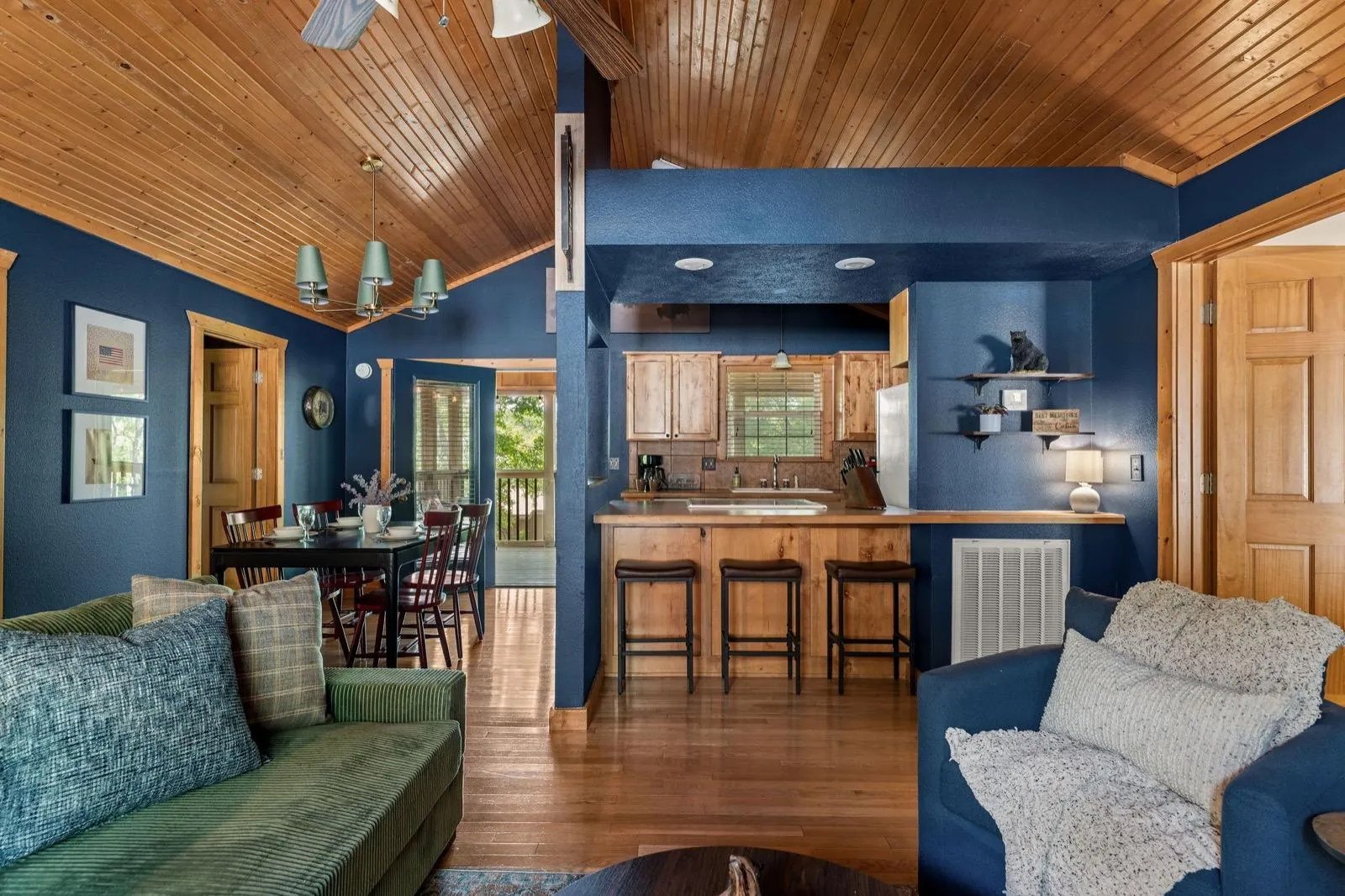 Looking from the sectional to the dining table and kitchen bar