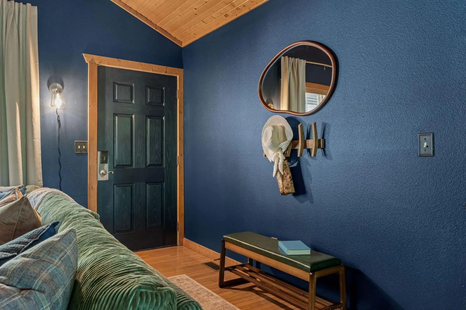 Entry with a mirror, hooks and a bench