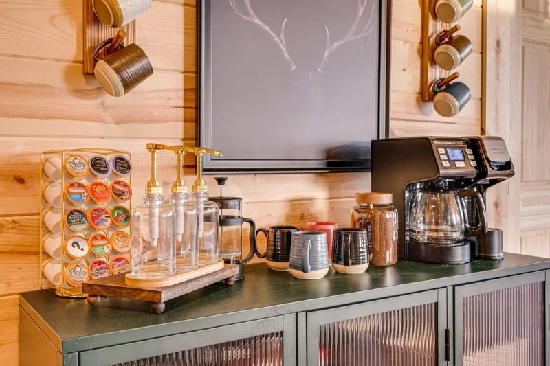 Coffee bar with K-cups and mugs on the wall