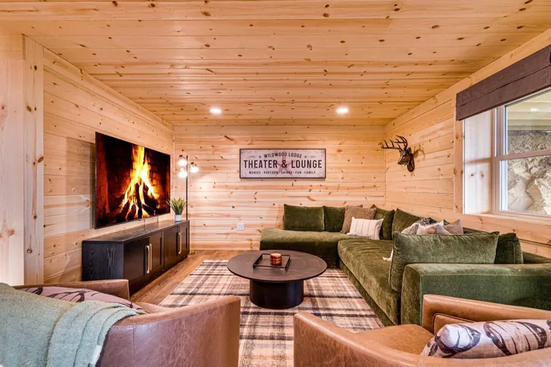 Theater and lounge with a green velvet sectional